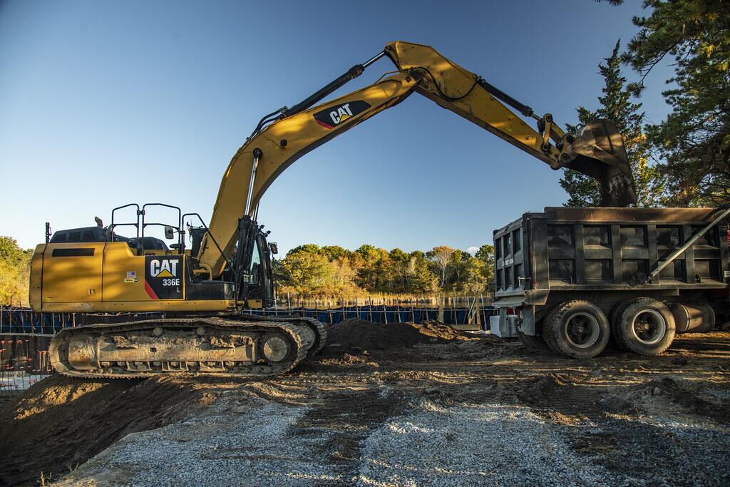 Excavator preparing the base of a sports facility