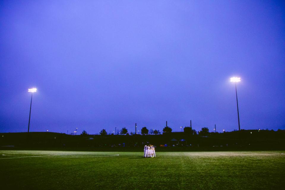 Floodlit sports field at night