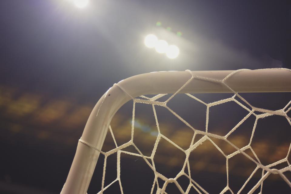 Football goal net under floodlights